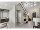 Grand entryway with high ceilings, stylish tile flooring, and a staircase at 257 Elder View Dr, Las Vegas, NV 89138
