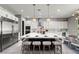 Modern kitchen featuring a large center island, pendant lighting, and stainless steel appliances at 257 Elder View Dr, Las Vegas, NV 89138