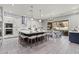 A modern kitchen boasts a large island with seating, stainless steel appliances, and stylish lighting at 257 Elder View Dr, Las Vegas, NV 89138