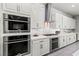 Modern kitchen features stainless steel appliances, white cabinetry, and a stylish backsplash at 257 Elder View Dr, Las Vegas, NV 89138