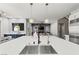 Contemporary kitchen with an island and breakfast bar, perfect for entertaining and casual dining at 257 Elder View Dr, Las Vegas, NV 89138