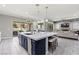 Open-concept kitchen featuring a large island, modern appliances, and seamless access to the living room at 257 Elder View Dr, Las Vegas, NV 89138