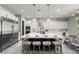 Modern kitchen featuring pendant lighting, island with seating, and stainless steel appliances at 257 Elder View Dr, Las Vegas, NV 89138
