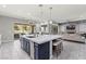 Spacious kitchen featuring an island with seating and stainless steel appliances at 257 Elder View Dr, Las Vegas, NV 89138