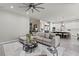 Bright living room features open floor plan, modern furniture, and a stylish ceiling fan at 257 Elder View Dr, Las Vegas, NV 89138