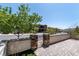 A cozy patio with stone accents and manicured landscaping provides a private outdoor living space at 257 Elder View Dr, Las Vegas, NV 89138