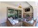 Outdoor patio with a fireplace, tv, and comfortable seating area at 257 Elder View Dr, Las Vegas, NV 89138