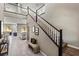 Elegant staircase with black and white railings, leading to the upper level of the home at 257 Elder View Dr, Las Vegas, NV 89138