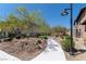 Scenic walkway with mature landscaping and neighborhood lighting fixtures at 257 Elder View Dr, Las Vegas, NV 89138