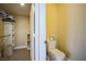 Toilet area featuring closet, shelving, and good lighting at 2608 Port Of Call Dr, Las Vegas, NV 89128