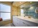 Bright bathroom featuring double sink vanity, large mirror, and good lighting at 2608 Port Of Call Dr, Las Vegas, NV 89128