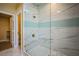 Modern bathroom with large walk-in shower featuring stone and tile at 2608 Port Of Call Dr, Las Vegas, NV 89128