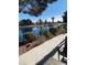 Relaxing view of the community lake and lush landscaping from a shaded outdoor seating area at 2608 Port Of Call Dr, Las Vegas, NV 89128