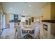 Open concept kitchen and dining room featuring marble floors and modern appliances at 2608 Port Of Call Dr, Las Vegas, NV 89128