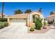 Charming single-story home featuring a two-car garage and desert landscaping at 2608 Port Of Call Dr, Las Vegas, NV 89128