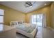 Bright main bedroom with slider, high ceiling, and modern furnishings at 2608 Port Of Call Dr, Las Vegas, NV 89128