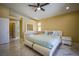 Spacious bedroom with ensuite bathroom, modern furniture, and abundant natural light at 2608 Port Of Call Dr, Las Vegas, NV 89128