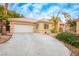 Charming single-story home featuring a two-car garage and low-maintenance desert landscaping at 2622 Rimpacific Cir, Las Vegas, NV 89146
