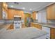Spacious kitchen with granite countertops, wood cabinets and stainless steel appliances at 2622 Rimpacific Cir, Las Vegas, NV 89146