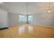 Open living room with vaulted ceilings, hardwood floors, and plenty of natural light at 2622 Rimpacific Cir, Las Vegas, NV 89146