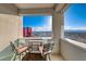 Balcony featuring two chairs, a small table, and stunning city views at 2700 Las Vegas Blvd # 3501, Las Vegas, NV 89109