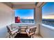 Balcony featuring two chairs, a small table, and incredible views of the city at 2700 Las Vegas Blvd # 3501, Las Vegas, NV 89109