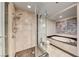 Modern bathroom with tiled glass enclosed shower and a soaking tub with marble trim at 2700 Las Vegas Blvd # 3501, Las Vegas, NV 89109