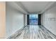 A bedroom with hardwood floors and large windows offering an expansive city view at 2700 Las Vegas Blvd # 3501, Las Vegas, NV 89109