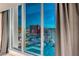 Breathtaking city view through large windows with stylish curtains, showcasing the vibrant cityscape at 2700 Las Vegas Blvd # 3501, Las Vegas, NV 89109