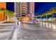 Luxury high-rise with landscaped entrance and water feature at night at 2700 Las Vegas Blvd # 3501, Las Vegas, NV 89109