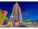 High-rise condo building with fountain and landscaping at night in Las Vegas at 2700 Las Vegas Blvd # 3501, Las Vegas, NV 89109
