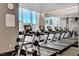 Well-equipped gym with modern treadmills, weights, and cityscape views through large windows at 2700 Las Vegas Blvd # 3501, Las Vegas, NV 89109
