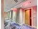 Hallway with painted walls, exit signs and custom blue and white patterned carpet at 2700 Las Vegas Blvd # 3501, Las Vegas, NV 89109