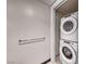 A laundry room with a stacked white washer and dryer unit and a metal towel rack on the wall at 2700 Las Vegas Blvd # 3501, Las Vegas, NV 89109