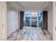 Bright living room featuring hardwood floors, floor to ceiling glass doors, and beautiful city views at 2700 Las Vegas Blvd # 3501, Las Vegas, NV 89109