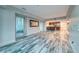 Open concept living space with wood floors, wet bar, and floor-to-ceiling window views at 2700 Las Vegas Blvd # 3501, Las Vegas, NV 89109