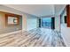Bright and airy living room featuring wood floors and large windows offering city views at 2700 Las Vegas Blvd # 3501, Las Vegas, NV 89109
