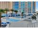 Stunning pool area with ample lounge chairs, umbrellas, and palm trees, offering a resort-style experience for residents at 2700 Las Vegas Blvd # 3501, Las Vegas, NV 89109