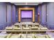 Home theater featuring multiple tiers of seating and a large screen at 2700 Las Vegas Blvd # 3501, Las Vegas, NV 89109