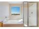 Bathroom featuring a soaking tub and separate glass shower at 2739 Cramond St, Henderson, NV 89044