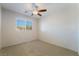Bedroom featuring neutral carpeting, a window, and a ceiling fan at 2739 Cramond St, Henderson, NV 89044