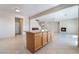 Kitchen island and eat-in kitchen flows into a living room with a fireplace and ample space for entertaining at 2739 Cramond St, Henderson, NV 89044