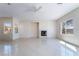 Bright living room with tile floors, fireplace, and lots of natural light at 2739 Cramond St, Henderson, NV 89044