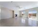 Spacious living room featuring a fireplace, ceiling fan, and sliding glass doors to the backyard at 2739 Cramond St, Henderson, NV 89044