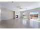 Spacious living room featuring a fireplace, ceiling fan, and sliding glass doors to the backyard at 2739 Cramond St, Henderson, NV 89044