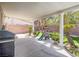 Covered patio with pillars overlooking a playhouse on artificial turf and some palm trees at 2743 Peekskill Ave, Henderson, NV 89052
