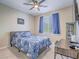 Cozy bedroom with a ceiling fan, bright window, and modern furnishings at 2743 Peekskill Ave, Henderson, NV 89052