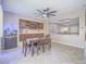 Open dining room with a contemporary ceiling fan and backyard views at 2743 Peekskill Ave, Henderson, NV 89052