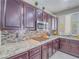 Close-up of kitchen featuring stainless steel appliances, modern countertops, and custom backsplash at 2743 Peekskill Ave, Henderson, NV 89052