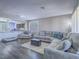 Open concept living room features hardwood floors, comfortable seating, and modern decor at 2743 Peekskill Ave, Henderson, NV 89052